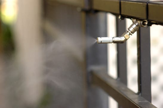 misting nozzle on iron fence